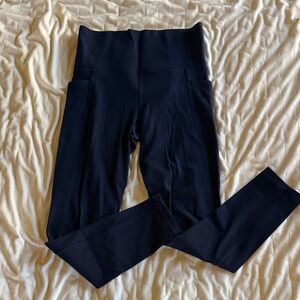 Athleta Salutation Stash 7/8 navy blue Leggings